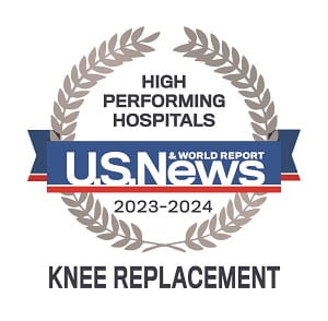 Badge that says High Performing Hospitals | US News and World Report | 2023 through 2024 | Knee Replacement